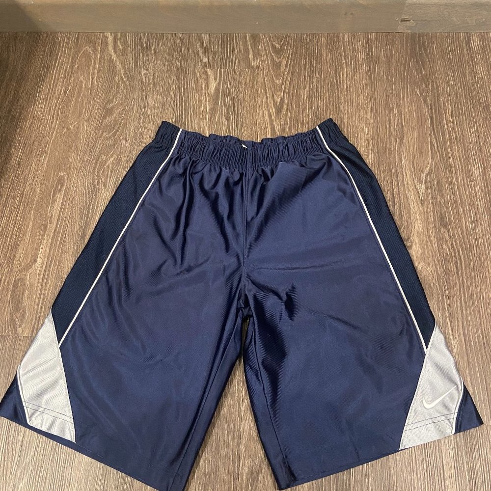 Large nike shorts, blue primary color with silver piping